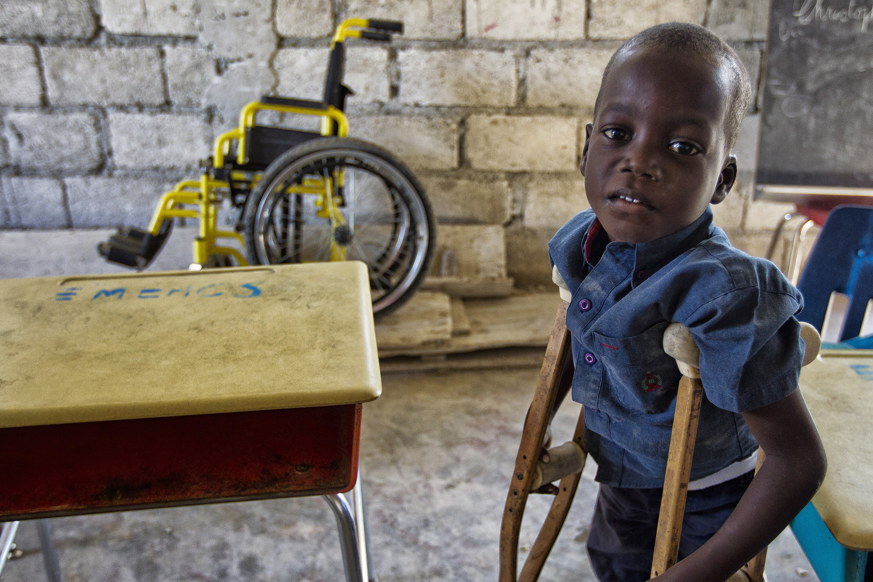A young student poses in the classroom, Port-au-Prince, Haiti 