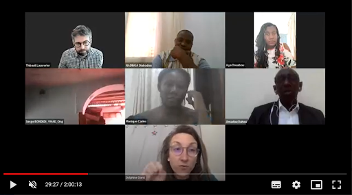 Screenshot of Zoom meeting showing 6 camera thumbnails with woman talking 